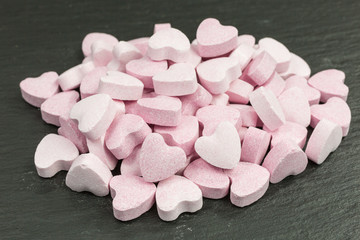 Fototapeta na wymiar sweet sugar candy hearts with popping candy