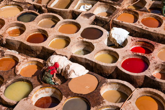 Man Dyeing Leather at a Tannery in the Medina of Fez Morocco