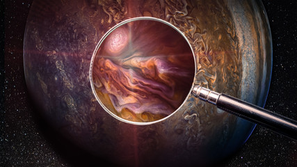Jupiter and magnifying glass. Searching the fuel fossil on an alien planets, concept. Elements of this image furnished by NASA.
