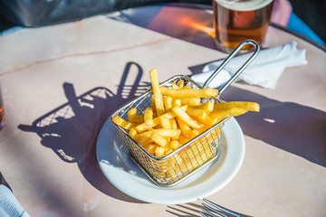 French fries on the restaurant table outdoors