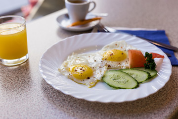 eggs with sausages and cheese and vegetables for breakfast
