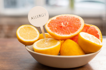 Close up of little bowl with grapefruits and lemons having allergens