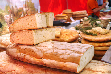 Italian food products, white bread and buns with rosemary.