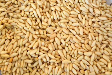 Texture of shelled pine nuts in flat lay angle.