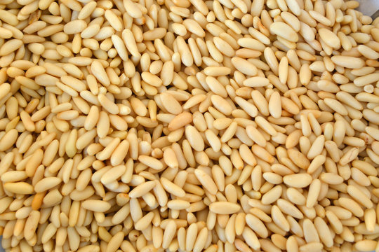 Texture of shelled pine nuts in flat lay angle.