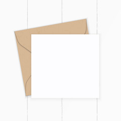 Flat lay top view elegant white composition letter kraft paper envelope on wooden background