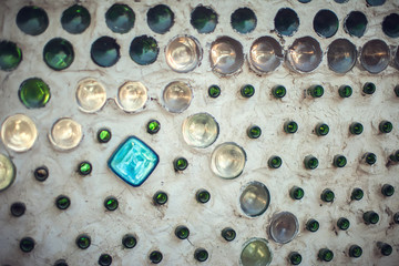 Glass bottles inside the wall background, abstract texture