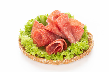 Sandwich with salami sausage on white background.