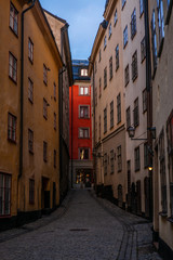 Old cobbled narrow street with coilorful houses in Stockholm in the morning - 2