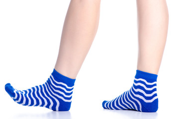 Female legs with blue socks fashion on background isolation