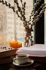  books coffee candles on the table