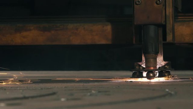 Side View Laser Cutter Cuts Part On A Sheet
