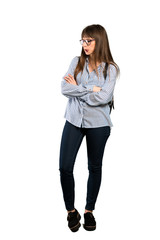 Full-length shot of Woman with glasses with confuse face expression while bites lip