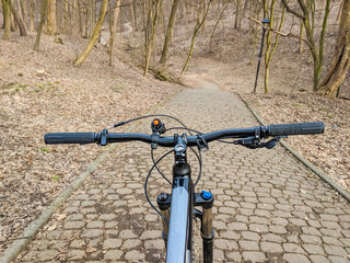 Naklejka na ściany i meble MTB bicycle on the trail in the spring season