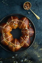 Easter cake and egg for the holiday. Homemade hot cross buns on Easter table.