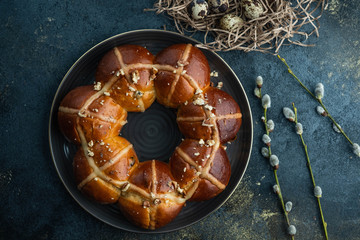Easter cake and egg for the holiday. Homemade hot cross buns on Easter table.