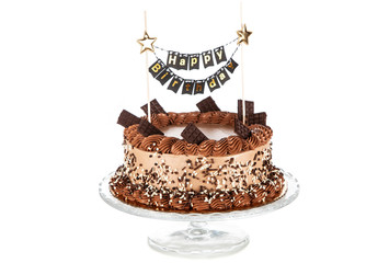 Decorated chocolate cake on dark background