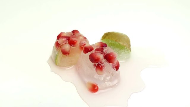 Time lapse of melting ices with fruits.
