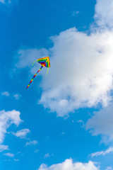 Kite flying in the sky among the clouds