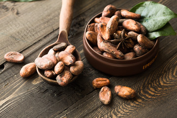  cacao nibs cacao beans on old wooden background