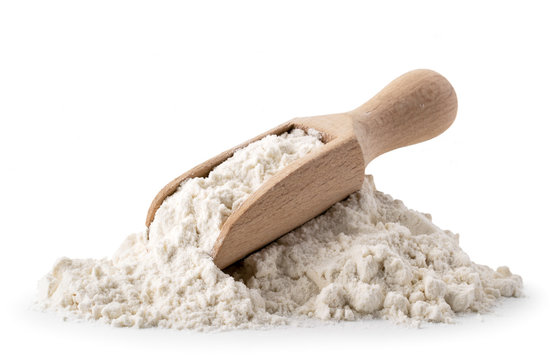 Pile of flour with wooden spoon on a white, isolated.