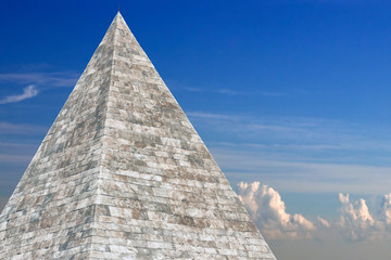 Fototapeta na wymiar Piramide Cestia Pyramid of Cestius, Rome, Italy, over a cloudy SKY background