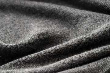 dark gray jersey folded textile texture background