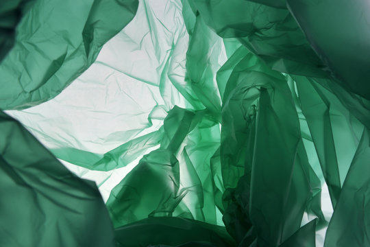 Plastic Bag Background. Empty Green Studio Abstract Background. Texture With Copy Space For Text.