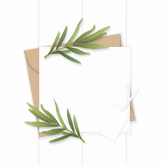 Flat lay top view elegant white composition letter kraft paper envelope nature tarragon leaf and tag on wooden background