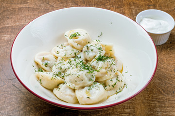 Dumplings with sour cream and herbs