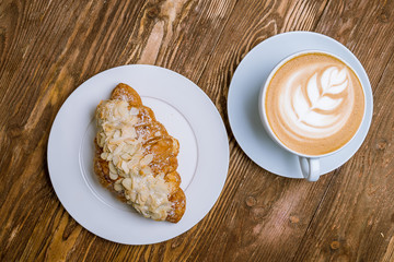 the almond croissant with a cappuccino