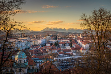 View over Ljubljana with sunset to mountain range Kamnik–Savinja Alps