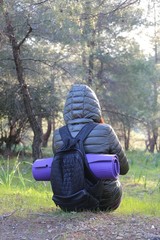 Fototapeta premium beautiful young girl walking in forest in running clothes standing on log .turkey