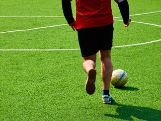 soccer player hits a ball dsfsdfsdfs , amator, hobby