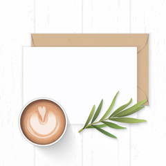 Flat lay top view elegant white composition paper kraft envelope tarragon leaf and coffee on wooden background