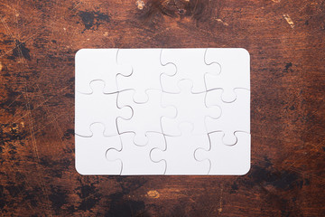 Jigsaw Puzzle with missing piece on old wooden background