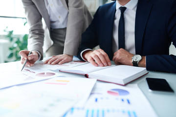 Young analysts discussing chart