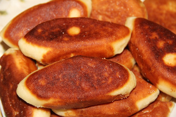 Traditional Russian or Ukrainian homemade pirozhki. Fried pies or patties.