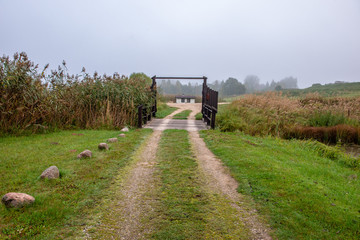 Fototapeta premium empty gravel road in autumn