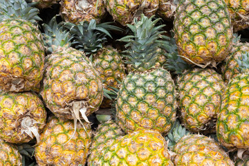 pile of pineapples in the market
