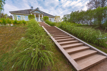 Grand stairs to old fashioned mansion in Russia