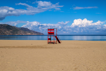 Red Lifeguardtower on a beach in crete, greece