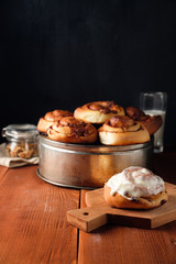 Freshly baked cinnamon buns with spices and cocoa filling. Sweet Homemade Pastry, dessert.