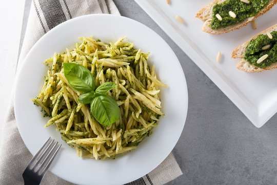 Traditional Trofie Pasta With Pesto Sauce On White Plate