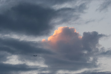 cloudy sky with plane