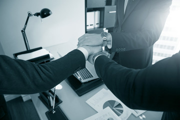 Business people stacking hands close up