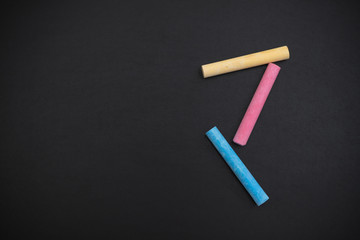 Background of blackboard with multicolored chalks