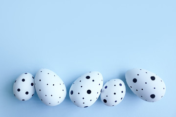 Ester eggs in isolated on blue background. Copy space