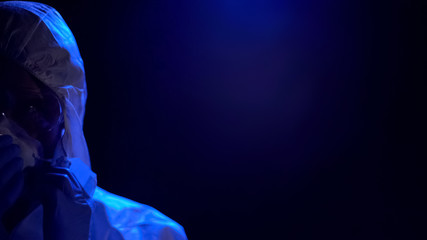 Lab assistant wearing protective mask, illegal experiment, pollution, quarantine