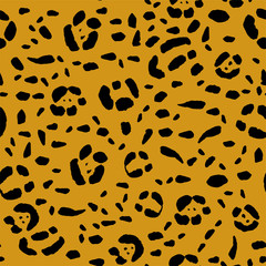 Seamless animal print, black spots on an orange background. Stock vector illustration.